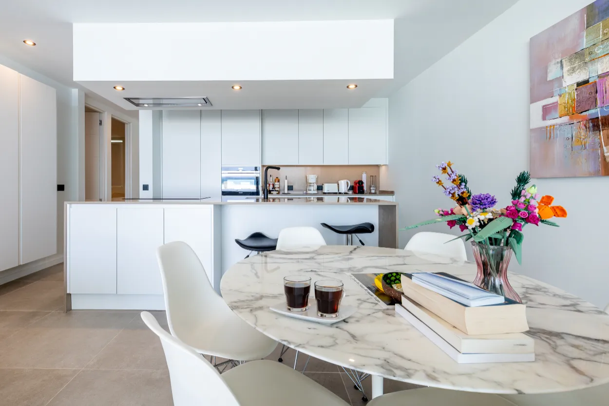 Vista del Silencio - kitchen-island-and-round-dining-table